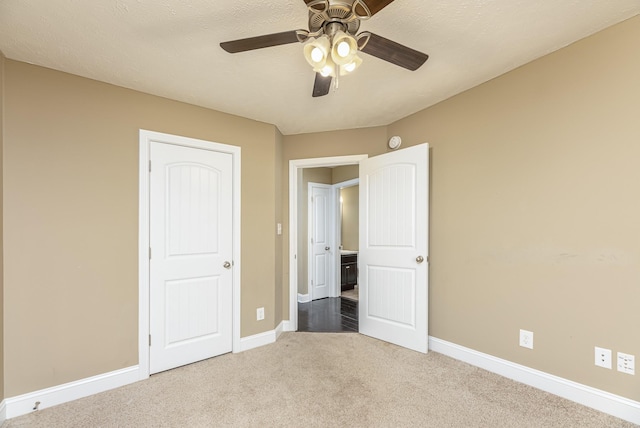 unfurnished bedroom with carpet flooring and ceiling fan