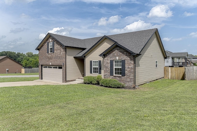 view of front of house featuring a garage and a front yard