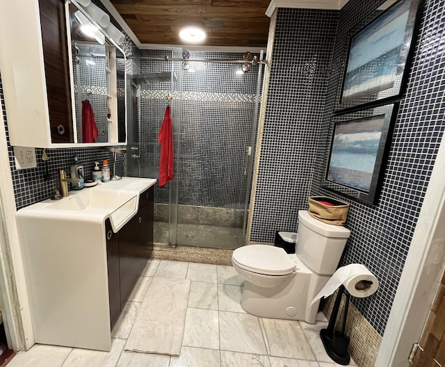 bathroom with a shower stall, toilet, vanity, wooden ceiling, and tile walls