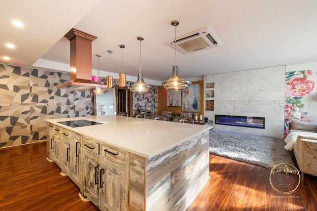 kitchen with island exhaust hood, dark wood-style flooring, hanging light fixtures, black electric cooktop, and open floor plan