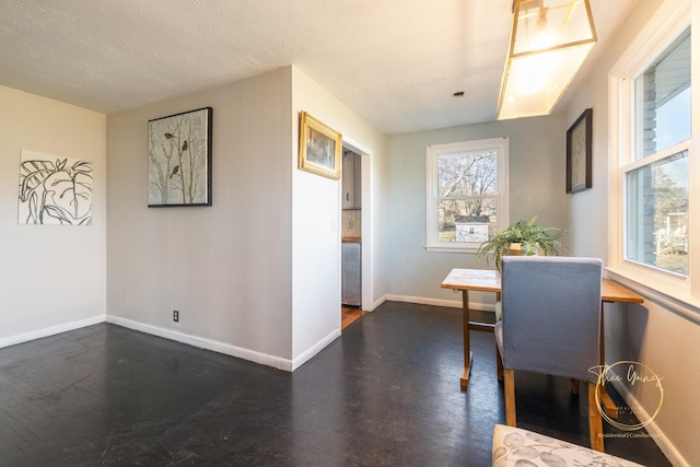 office space featuring dark wood-type flooring and baseboards