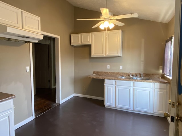 kitchen featuring sink, white cabinets, and ceiling fan