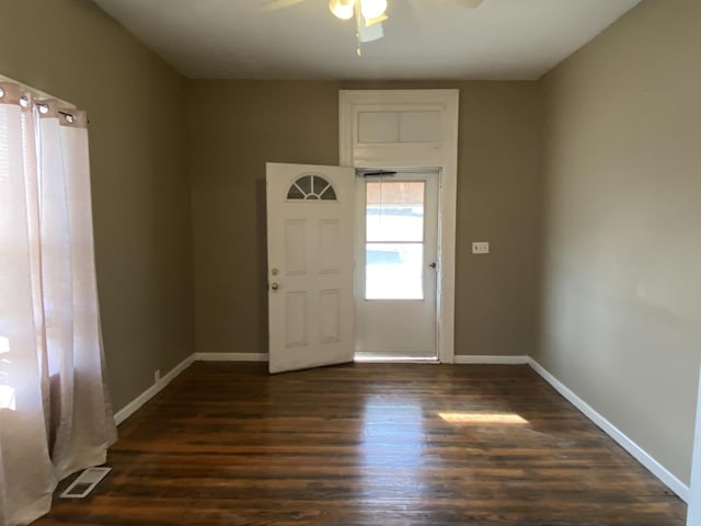 foyer featuring dark wood-type flooring and ceiling fan