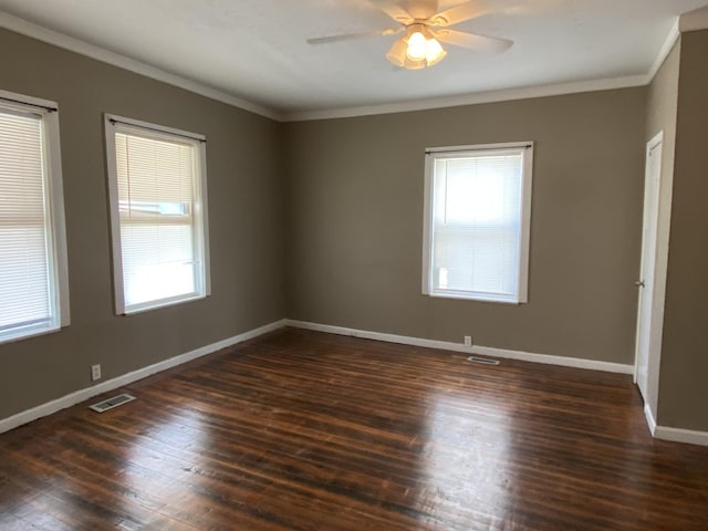 empty room with dark wood-type flooring, ceiling fan, and ornamental molding