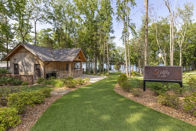 view of property's community with a lawn