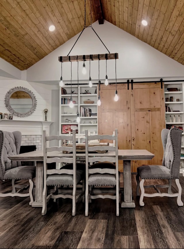 dining area featuring hardwood / wood-style floors, wooden ceiling, a barn door, and high vaulted ceiling