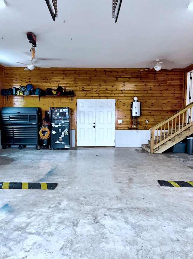 garage featuring wood walls