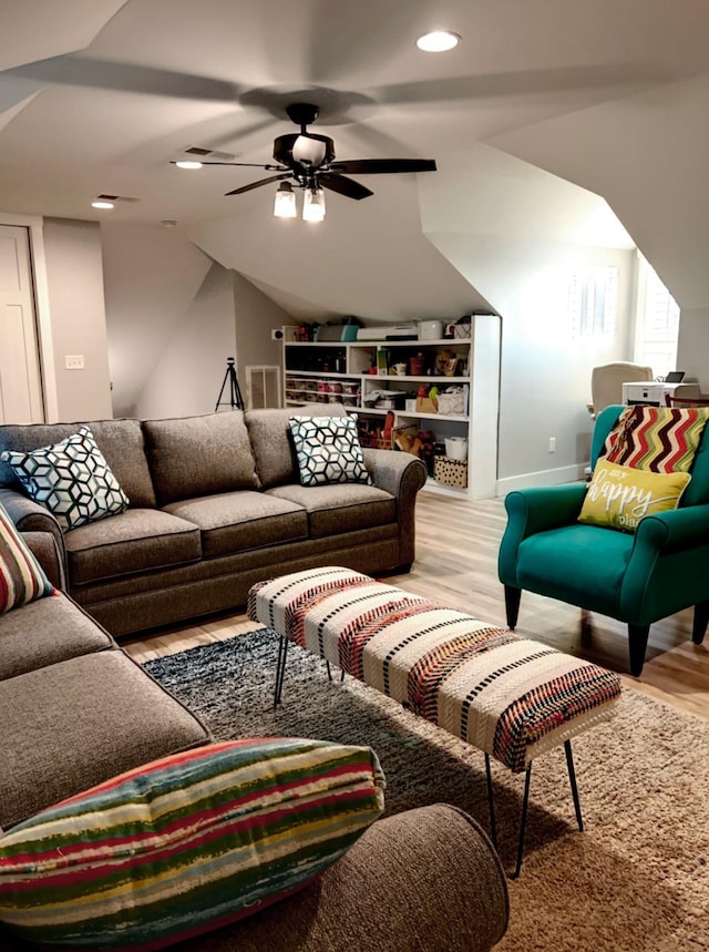 living room with ceiling fan and light hardwood / wood-style floors