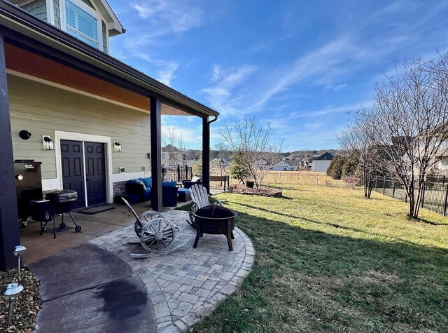 view of yard with a patio area and an outdoor fire pit