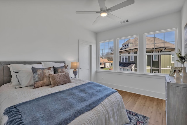 bedroom featuring wood-type flooring and ceiling fan