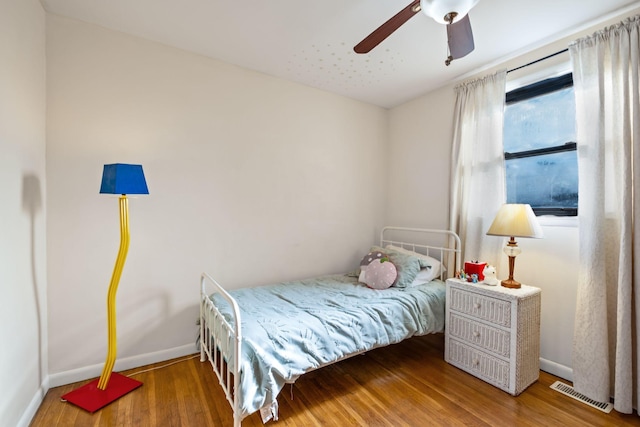 bedroom featuring hardwood / wood-style flooring and ceiling fan