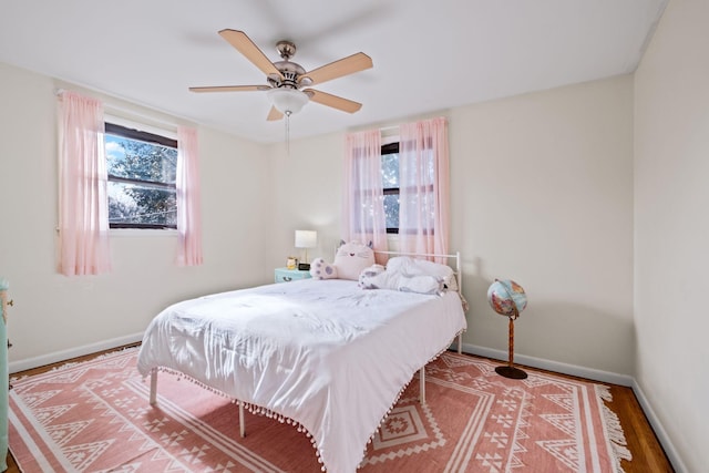 bedroom featuring ceiling fan and hardwood / wood-style floors