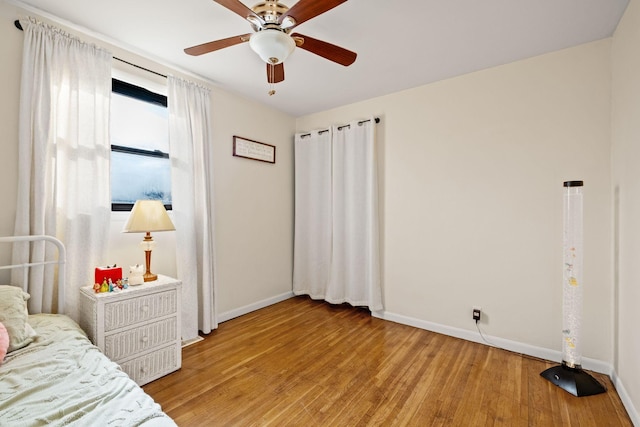 bedroom with ceiling fan and light wood-type flooring