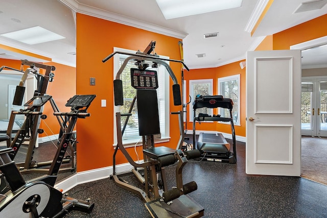 workout room featuring french doors and ornamental molding