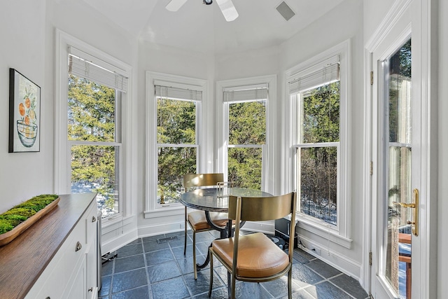 sunroom featuring ceiling fan