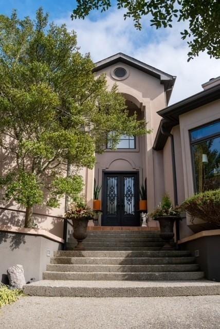 property entrance featuring french doors