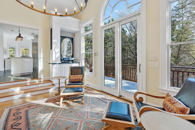 sunroom with an inviting chandelier