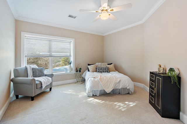 carpeted bedroom featuring ornamental molding and ceiling fan