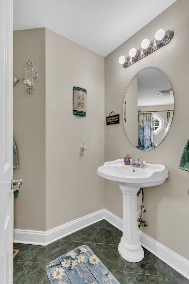 bathroom with tile patterned flooring