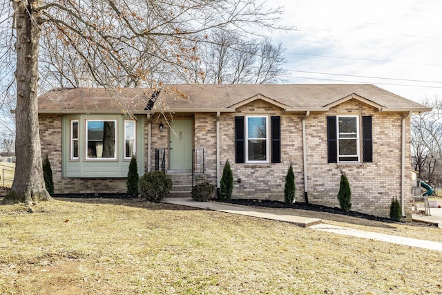 ranch-style home featuring a front yard