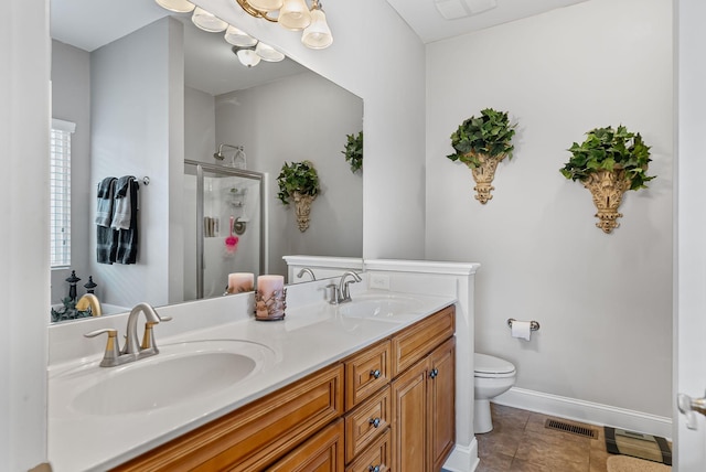 bathroom with walk in shower, vanity, toilet, and tile patterned flooring