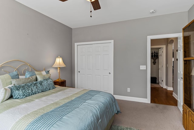 bedroom with carpet flooring, ceiling fan, and a closet