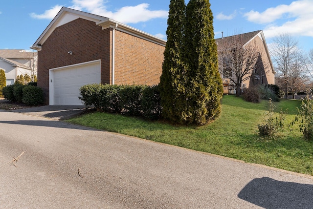 view of side of home featuring a lawn