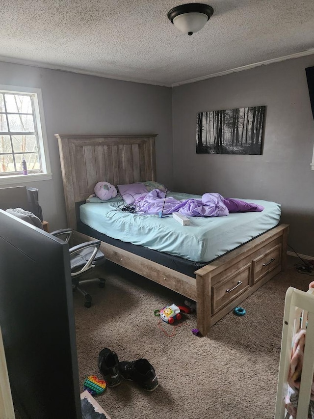 carpeted bedroom featuring a textured ceiling