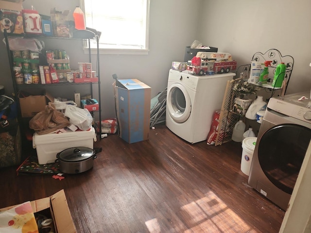 clothes washing area with dark wood-type flooring