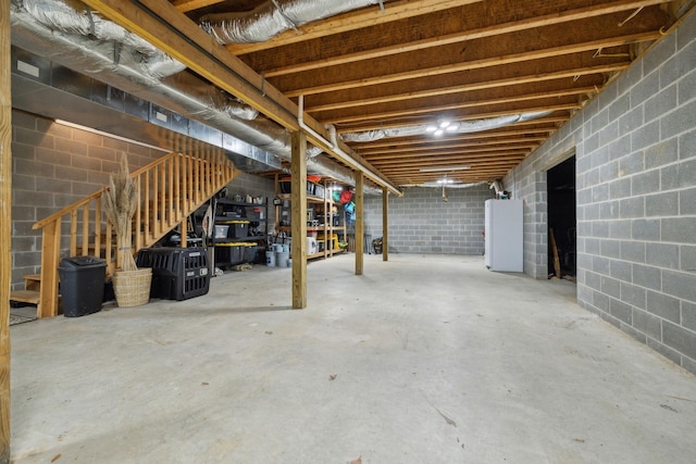 basement featuring white refrigerator