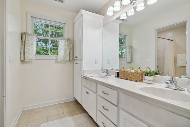 bathroom featuring a shower with curtain, tile patterned floors, vanity, and a wealth of natural light