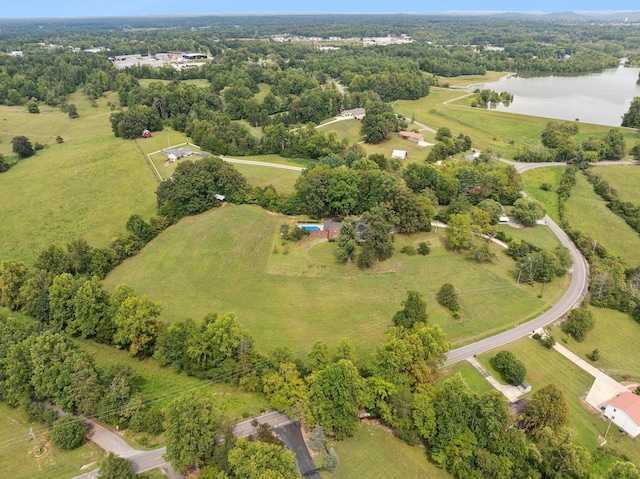 drone / aerial view featuring a water view and a rural view