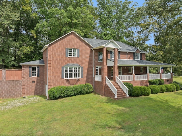 view of front of house with a front lawn and covered porch