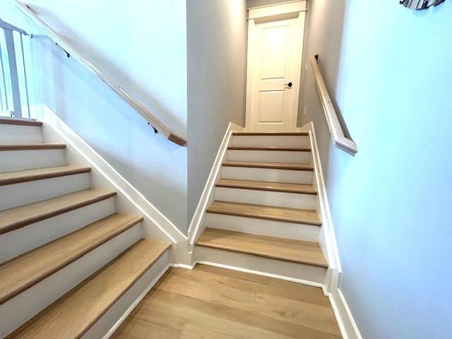 staircase featuring hardwood / wood-style flooring