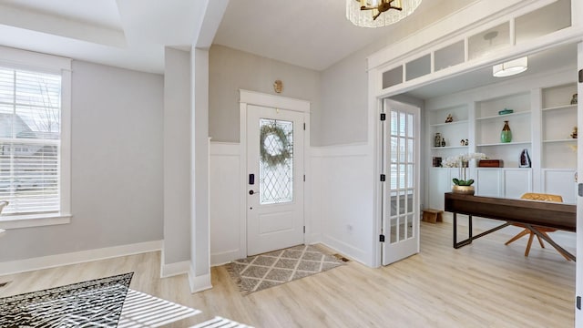 entrance foyer featuring a healthy amount of sunlight and light wood-type flooring