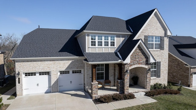 view of front of home with a garage and a porch