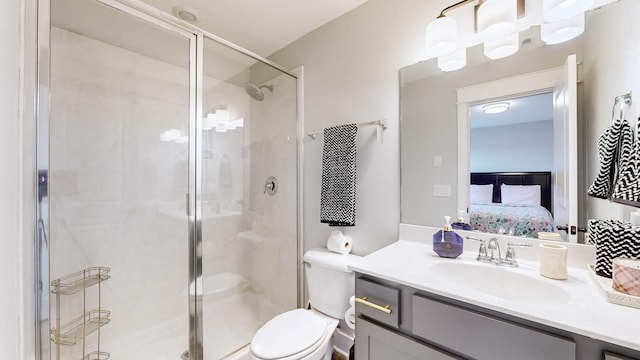 bathroom featuring walk in shower, vanity, and toilet