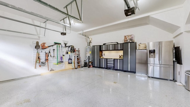 garage featuring stainless steel fridge with ice dispenser, a garage door opener, and water heater