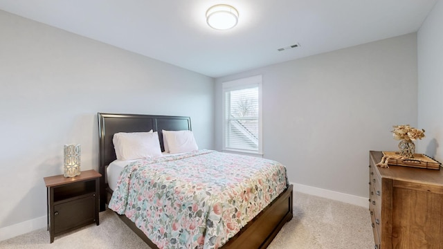 bedroom with light carpet