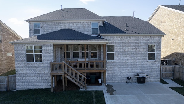 back of property with a patio