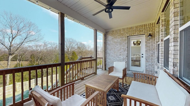 wooden deck featuring ceiling fan