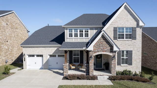 view of front of house featuring a garage and covered porch