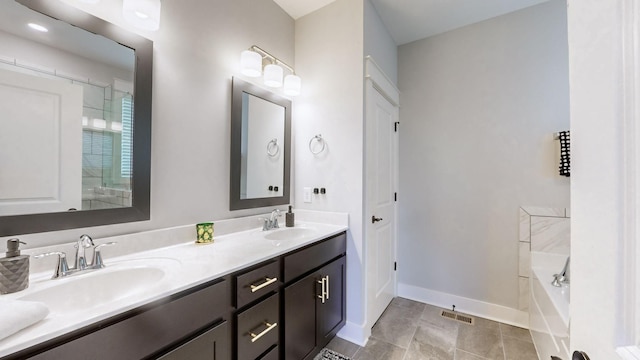 bathroom with vanity and a tub to relax in