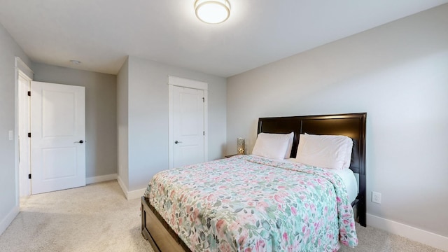 carpeted bedroom featuring a closet