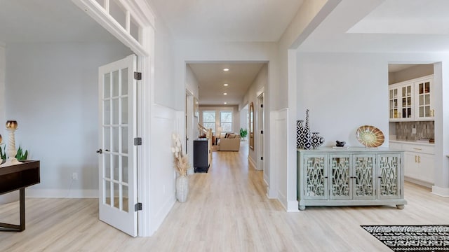 hallway with light wood-type flooring