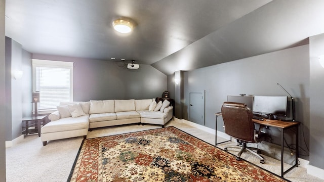 office space with lofted ceiling and carpet flooring