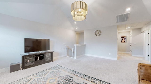 carpeted living room with lofted ceiling and an inviting chandelier