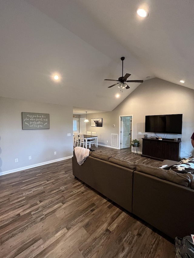 living room with hardwood / wood-style floors, vaulted ceiling, and ceiling fan