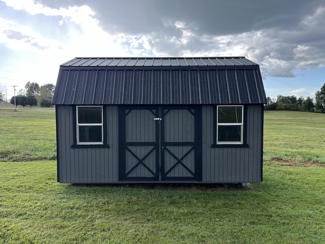 view of outdoor structure with a lawn