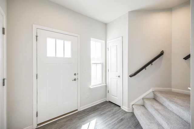 entrance foyer with a healthy amount of sunlight and hardwood / wood-style floors